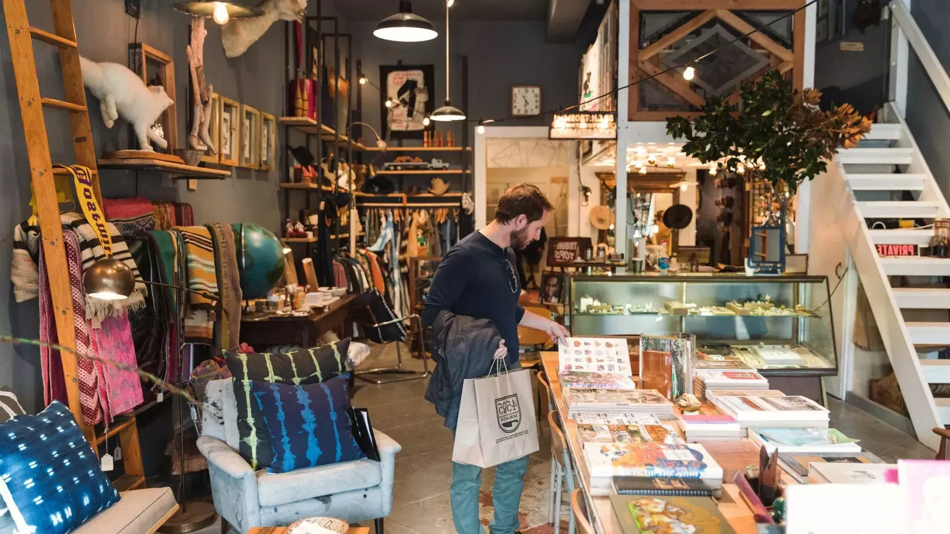 A man shops for items inside a boutique 在贝博体彩app's NoPa neighborhood.